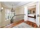 Upper hallway with hardwood floors and a view into a bedroom at 559 N Williams St, Denver, CO 80218