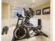 Basement home gym with elliptical and weight equipment at 559 N Williams St, Denver, CO 80218