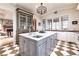 Island, white cabinets, marble countertops, checkerboard floor at 559 N Williams St, Denver, CO 80218