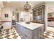Island, white cabinets, marble countertops, checkerboard floor at 559 N Williams St, Denver, CO 80218