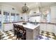 Island, white cabinets, marble countertops, checkerboard floor at 559 N Williams St, Denver, CO 80218