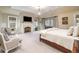 Spacious main bedroom with fireplace, large windows, and sitting area at 559 N Williams St, Denver, CO 80218