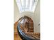 A winding staircase with dark wood and metal accents connects the floors at 559 N Williams St, Denver, CO 80218