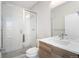 Modern bathroom featuring subway tile shower with glass enclosure and updated vanity at 3520 W Conejos Pl # 11, Denver, CO 80204