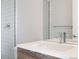 Modern bathroom featuring sleek vanity, contemporary faucet, and tiled shower at 3520 W Conejos Pl # 11, Denver, CO 80204
