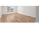 Bright, airy bedroom with large window and light wood flooring at 3520 W Conejos Pl # 11, Denver, CO 80204