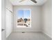 Bedroom featuring neutral decor, closet and large window with neighborhood view at 3520 W Conejos Pl # 11, Denver, CO 80204