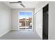 Inviting bedroom with sliding glass doors to deck, closet and plush carpet at 3520 W Conejos Pl # 11, Denver, CO 80204