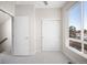 Well-lit bedroom with large window, closet, and neutral tones, creating a calming and inviting atmosphere at 3520 W Conejos Pl # 11, Denver, CO 80204