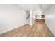 Bright living room featuring hardwood floors and staircase, creating an inviting and spacious living area at 3520 W Conejos Pl # 11, Denver, CO 80204