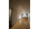 Bright living area seamlessly flows into a modern kitchen with gleaming hardwood floors at 3520 W Conejos Pl # 11, Denver, CO 80204