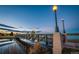Picturesque park bridge reflects in tranquil waters, with serene blue skies above at 3520 W Conejos Pl # 11, Denver, CO 80204