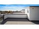 Large rooftop deck with wood flooring, great for enjoying sunny days and outdoor living at 3520 W Conejos Pl # 11, Denver, CO 80204