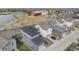 Home overlooking the park, adjacent to a serene lake, and a red barn, offering a blend of natural beauty at 10610 Reunion Pkwy, Commerce City, CO 80022
