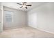 Bedroom features carpet, ceiling fan, closet with sliding doors, and neutral paint at 10610 Reunion Pkwy, Commerce City, CO 80022