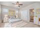 Bedroom features carpet, bed, nightstands, and closet with sliding doors at 10610 Reunion Pkwy, Commerce City, CO 80022