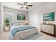 A staged bedroom shows well with furnishings and decor at 10610 Reunion Pkwy, Commerce City, CO 80022