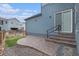 Brick patio with landscaped yard provides an outdoor space, enhanced by direct access to the home's interior at 10610 Reunion Pkwy, Commerce City, CO 80022