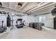 Basement includes an exercise area with treadmill and weight equipment plus a full bed at 745 N Tempe St, Aurora, CO 80018