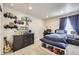 Comfortable bedroom with a dresser and carpeted flooring at 745 N Tempe St, Aurora, CO 80018