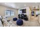 Bonus room with large TV, movie viewing equipment, two bean bag chairs, and large window at 745 N Tempe St, Aurora, CO 80018