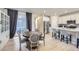 Elegant dining area adjacent to the kitchen, showcasing a round table, stylish chairs, and seamless access to the outdoor patio at 745 N Tempe St, Aurora, CO 80018