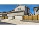 Exterior view of home's garage doors with decorative stone and gravel accents at 745 N Tempe St, Aurora, CO 80018