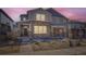 Charming two-story home featuring a stone facade, covered porch, and well-maintained landscaping in a vibrant community at 745 N Tempe St, Aurora, CO 80018