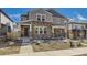 Charming two-story home featuring a stone facade, covered porch, and well-maintained landscaping in a vibrant community at 745 N Tempe St, Aurora, CO 80018