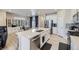 Bright kitchen features an island with stainless steel appliances and an adjacent breakfast nook at 745 N Tempe St, Aurora, CO 80018