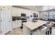 Modern kitchen with stainless steel appliances, a large island with bar seating, and ample counter space for meal preparation at 745 N Tempe St, Aurora, CO 80018