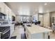 Spacious kitchen with an island, seamlessly connecting to the open-concept living space for easy entertaining and Gathering gatherings at 745 N Tempe St, Aurora, CO 80018