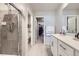 Modern main bathroom with a walk-in shower and a vanity with ample countertop space at 745 N Tempe St, Aurora, CO 80018
