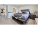 Spacious main bedroom with walk-in closet boasts a decorative dresser and calming natural light at 745 N Tempe St, Aurora, CO 80018