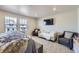Bright main bedroom featuring a sitting area, providing a relaxing space to unwind at 745 N Tempe St, Aurora, CO 80018