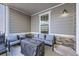 Cozy covered patio with comfortable seating surrounding a fire pit, great for relaxing outdoors at 745 N Tempe St, Aurora, CO 80018