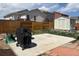 Cozy backyard featuring a patio area, wooden fence, storage shed, and some lawn at 9533 Cherry Ln, Thornton, CO 80229