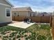 Fenced yard showing a patio area, a grill and some outdoor equipment and furniture at 9533 Cherry Ln, Thornton, CO 80229