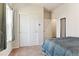 Cozy bedroom with neutral carpet and a large closet with sliding doors and a large window at 9533 Cherry Ln, Thornton, CO 80229