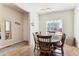 Dining room features hardwood floors and large window at 9533 Cherry Ln, Thornton, CO 80229