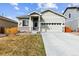 Charming single-Gathering home with a well-maintained lawn and a two-car garage in a suburban neighborhood at 9533 Cherry Ln, Thornton, CO 80229