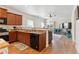 Kitchen featuring wood cabinets, granite counters, and stainless steel appliances at 9533 Cherry Ln, Thornton, CO 80229