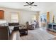Living room with hardwood floors, a ceiling fan, and natural light at 9533 Cherry Ln, Thornton, CO 80229