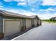 Row of garages in a neutral color with brick accents at 12820 Ironstone Way # 103, Parker, CO 80134