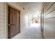 Exterior hallway with white siding and brown doors, with stairs in the background at 12820 Ironstone Way # 103, Parker, CO 80134