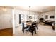 Inviting living room with natural light, dining area, sliding glass door and comfortable seating at 12820 Ironstone Way # 103, Parker, CO 80134