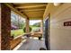 Charming covered patio with brick accents, outdoor seating, and a pleasant view of the neighborhood at 12820 Ironstone Way # 103, Parker, CO 80134