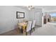 Dining area with a light wood table, seating for four, and a view of the balcony at 2 Adams St # 806, Denver, CO 80206