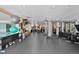 Spacious gym with weights, machines, and a mirrored wall for a comprehensive fitness experience at 2 Adams St # 806, Denver, CO 80206