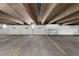 Spacious parking garage with painted parking spot markers for condo residents at 2 Adams St # 806, Denver, CO 80206